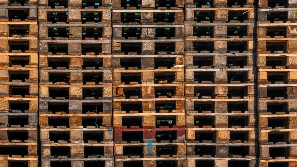 stacked refurbished timber pallets in warehouse Penrith